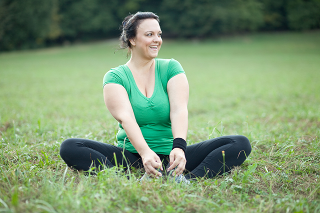 shaming-heavier-woman-greenshirt-in-grass-640