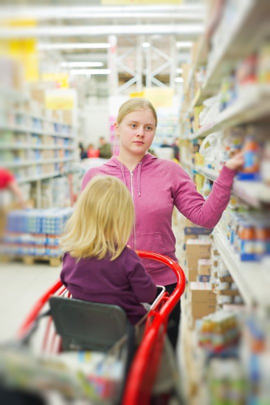 Mother and toddler shopping for groceries.