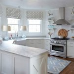 Blue table lamps in bright farmhouse kitchen