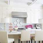 White kitchen with table lamps on the countertop