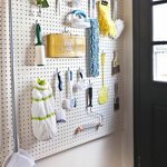 Pegboard wall with cleaning supplies