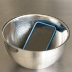 iPhone in metal bowl