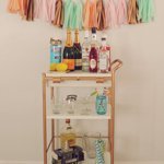 Gold and white utility cart turned bar cart