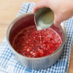 Adding lemon juice to the strawberries