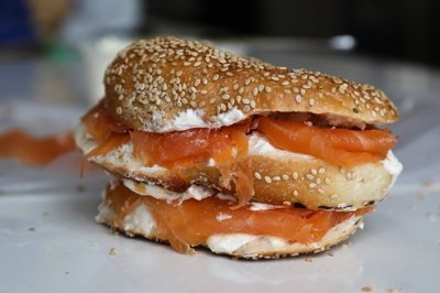 a bagel with cream cheese and salmon