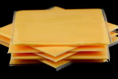 Wrapped American cheese slices.